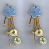 Handmade earrings with blue ceramic flowers